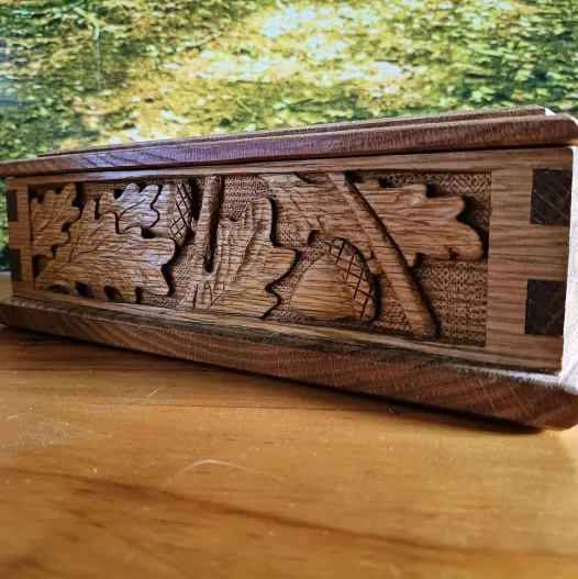 Handcarved oak leaves and acorns on an oak cigar box